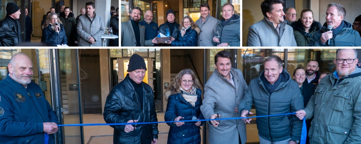 Personen beim Durchschneiden des Eröffnungsbandes